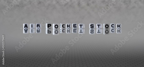 air pocket stock word or concept represented by black and white letter cubes on a grey horizon background stretching to infinity