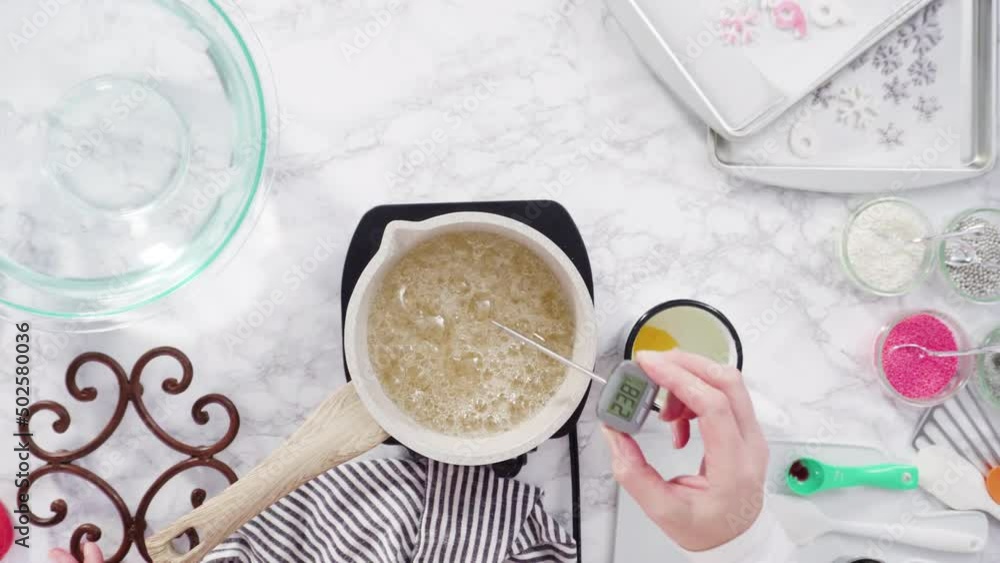 Flat lay. Step by step. Caramelizing sugar in a small cooking pot over the small electric stove. Flat lay. Step by step. Caramelizing sugar in a small cooking pot over the small electric stove.