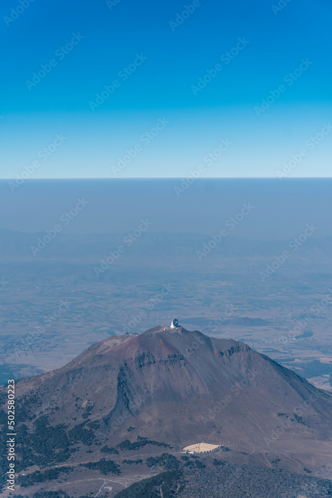 aerial view of the sierra negra volcano and the millimeter telescope