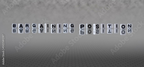 Photography bargaining position word or concept represented by black and white letter cubes