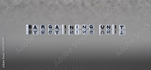 Fotografi bargaining unit word or concept represented by black and white letter cubes on a