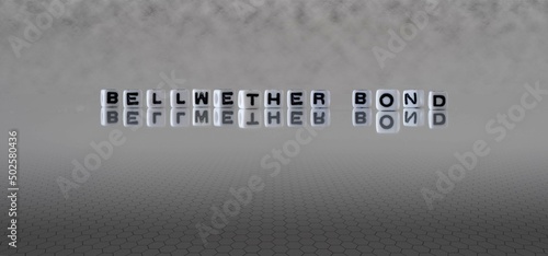 Photos bellwether bond word or concept represented by black and white letter cubes on a