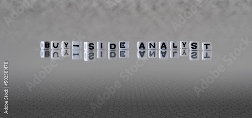 buy side analyst word or concept represented by black and white letter cubes on a grey horizon background stretching to infinity