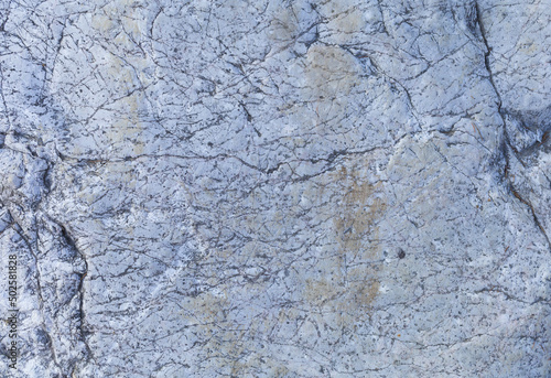 Grey stone background, light blue gray granite textured surface