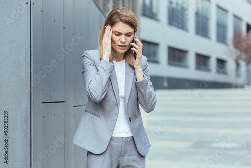 Photography Middle aged business woman, patient has severe headache, businesswoman trying to
