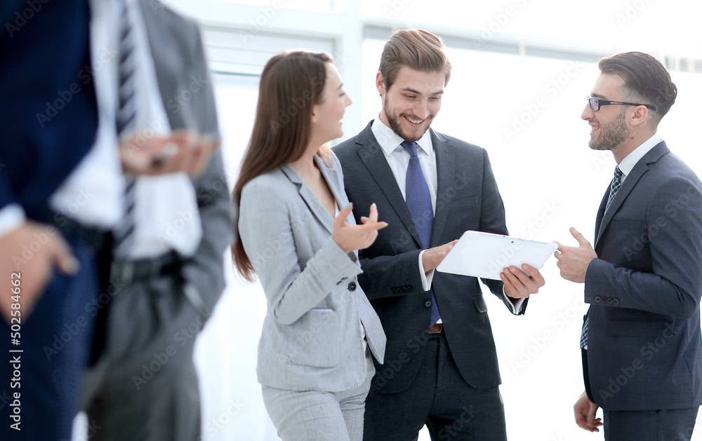 Business people are using gadgets and smiling while working Business people are using gadgets and smiling while working