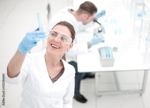 smiling scientist looking at the test results