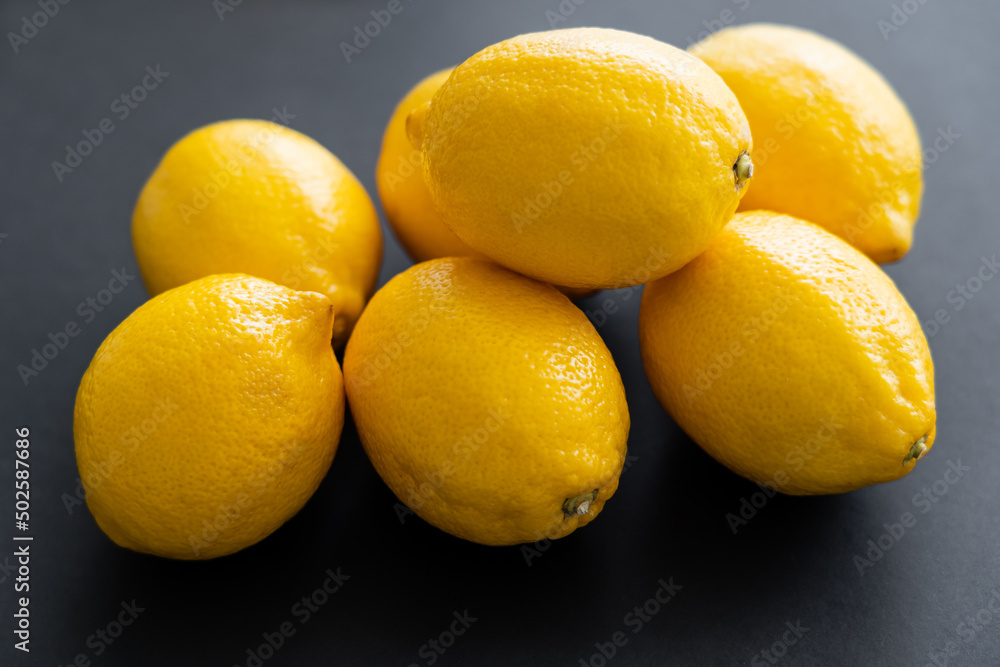 Close up view of juicy lemons on black background Close up view of juicy lemons on black background