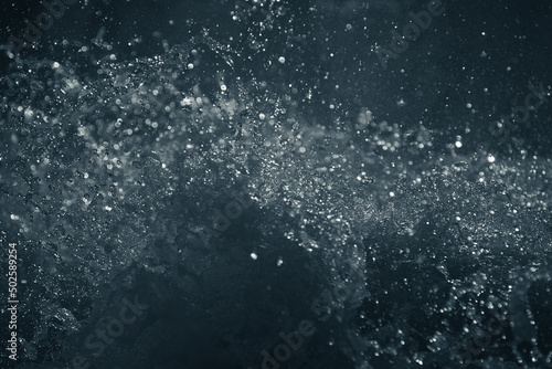 Scattered water particles. Beautiful highlights and bokeh