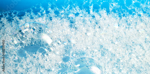 Close up of soap bubbles for laundry detergent, spa or washing powder concepts