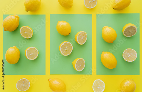 Top view of fresh bright lemons on green and yellow background