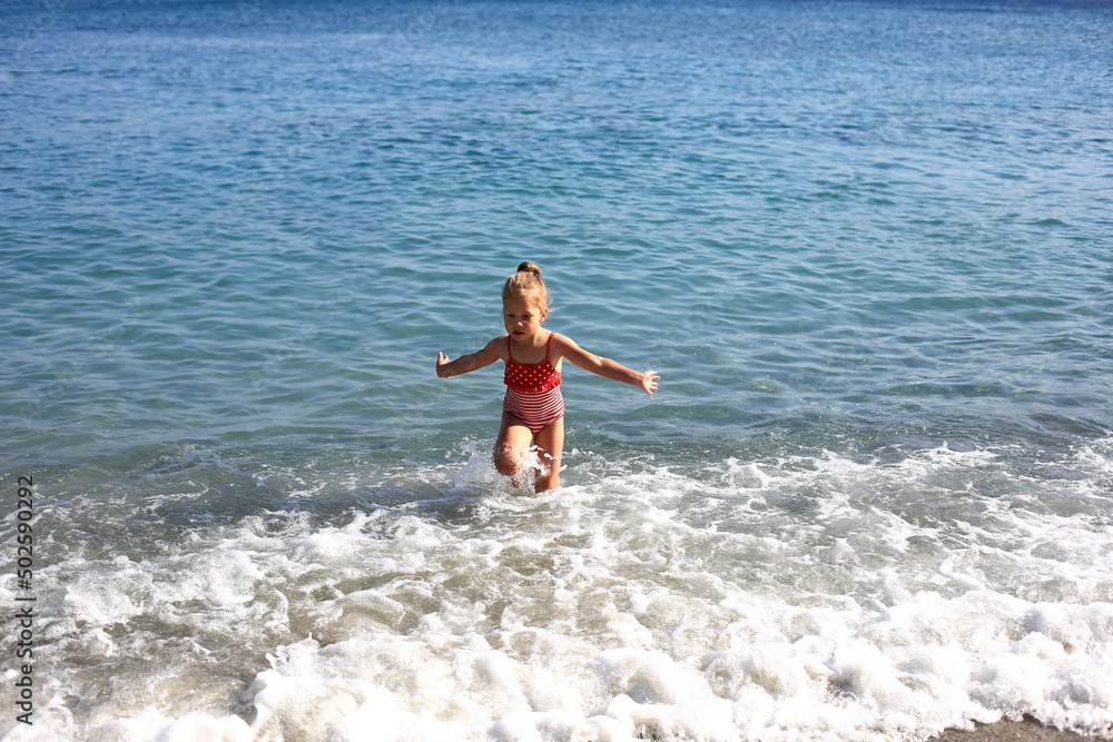 baby in the waves by the sea baby in the waves by the sea