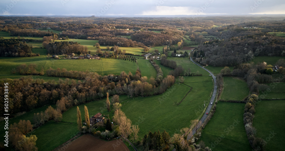 Panoramic view of natural landscape with road and fields in the Dordogne near Monpazier