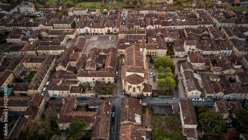 Top wide drone view of the beautiful little village of Monpazier in Périgord at sunset, Dordogne