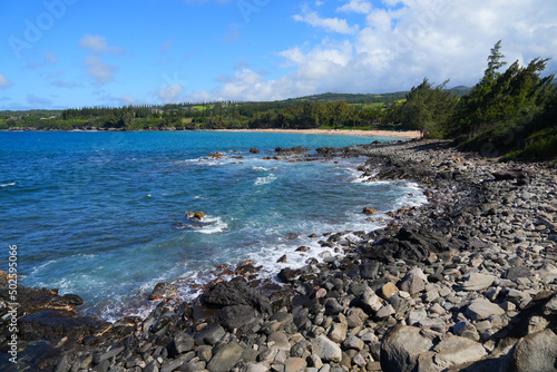 D.T. Fleming Park beach as seen from Makaluapuna Point in West Maui, Hawaii - Rocky coastline with high surf in the Pacific Ocean