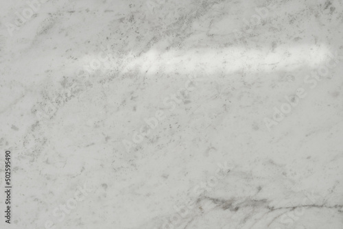 Top view flat lay background with organic shadows, bokeh, and texture on a marble background. Minimal summer lights and shadow concept.