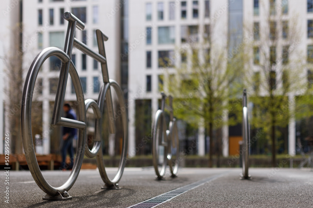 Designer bike parking, modern style. Metal frames in the shape of a bicycle.