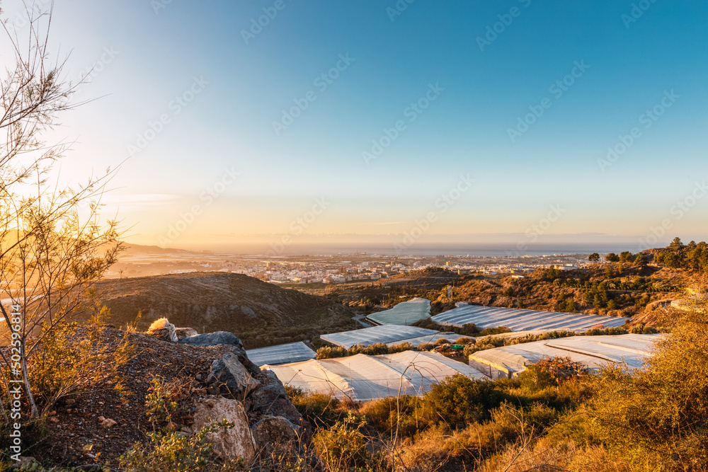 Golden sunset in the greenhouses on the coast of Granada, Andalucia, Spain
