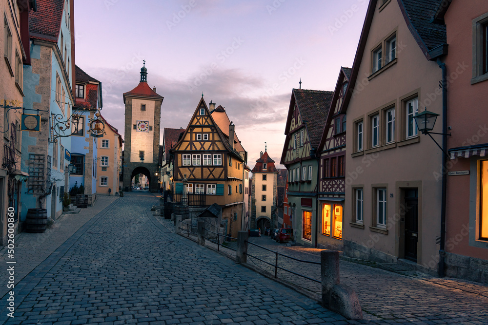 romantic Rothenburg ob der Tauber in the evening with city lights