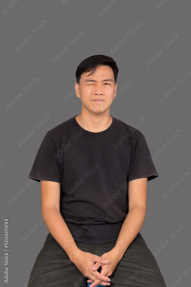 Portrait of a man Asian standing in black t-shirt and shorts. Isolated on gray background with copy space and clipping path Portrait of a man Asian standing in black t-shirt and shorts. Isolated on gray background with copy space and clipping path
