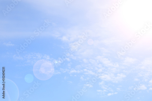 sunbeam of light on blue sky with clouds