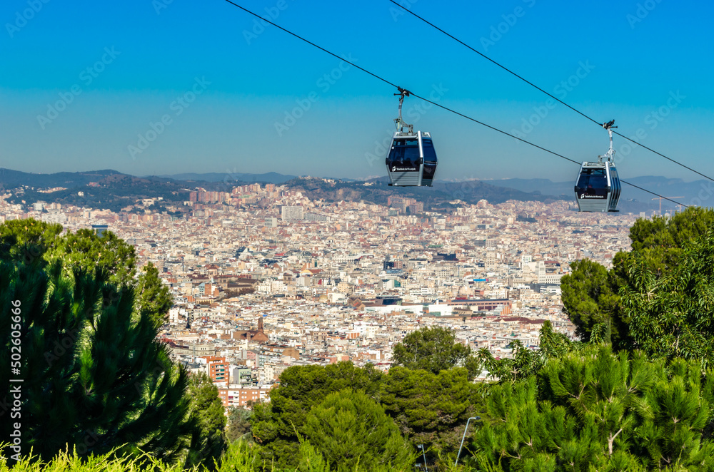 BARCELONA, SPAIN - DECEMBER 7, 2013: Cityscape of Barcelona from Montjuic  Hill, with Montjuic Cable Car in the foreground, a gondola lift in  Barcelona, Catalonia, Spain Photos | Adobe Stock