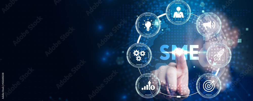The concept of business, technology, the Internet and the network. A young entrepreneur working on a virtual screen of the future and sees the inscription: SME The concept of business, technology, the Internet and the network. A young entrepreneur working on a virtual screen of the future and sees the inscription: SME