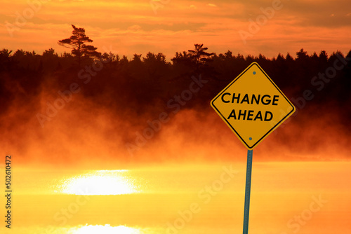Canada, Nova Scotia, Caution sign beside lake at sunrise photo