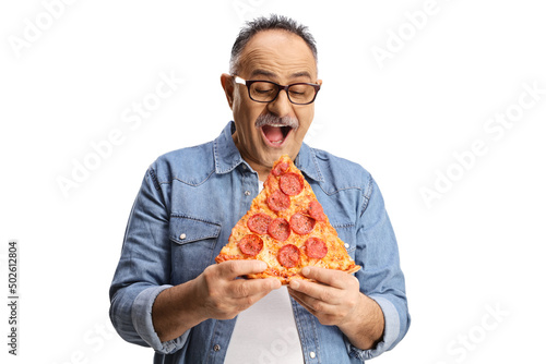 Happy mature man biting pepperoni pizza slice