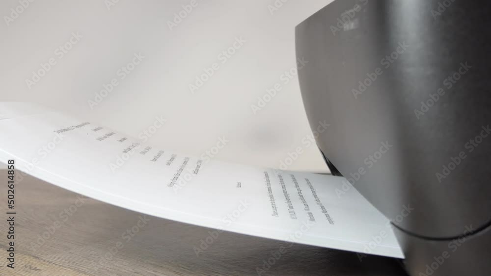 Printer In Action. Paper sheet being printed. Detail shot of black printer machine printing out documents in office environment. 4 k video Printer In Action. Paper sheet being printed. Detail shot of black printer machine printing out documents in office environment. 4 k video