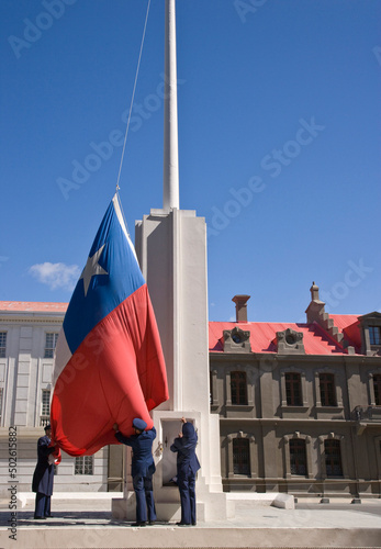 Three army soldiers raising the Chilean Flag, Punta Arenas, Patagonia, Chile photo