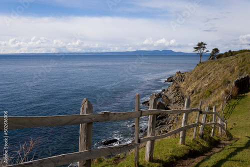 Wooden fence at the seaside, Fort Bulnes, Magellanes, Chile photo