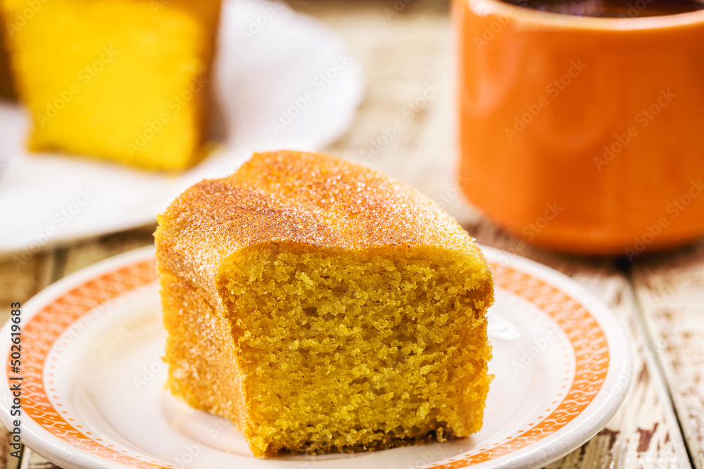 Brazilian cornmeal cake, yellow corn cake served at the June Festivals of Minas Gerais, served with coffee Brazilian cornmeal cake, yellow corn cake served at the June Festivals of Minas Gerais, served with coffee