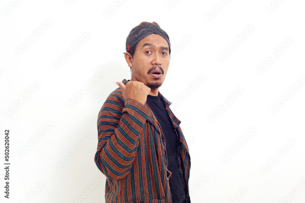 Asian man standing and presenting something sideways. Isolated on white background