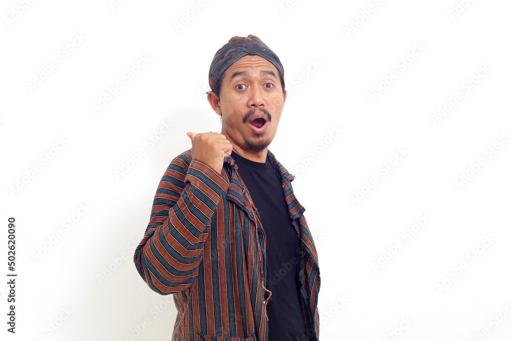 Asian man standing and presenting something sideways. Isolated on white background Asian man standing and presenting something sideways. Isolated on white background