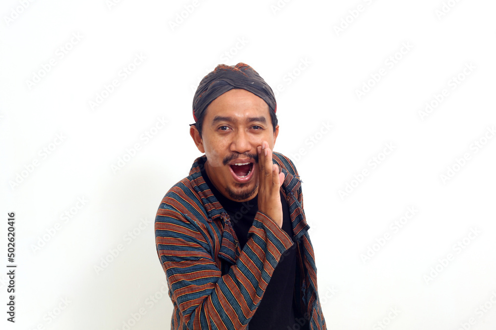 Happy asian man announcing information with hand around mouth isolated on white background Happy asian man announcing information with hand around mouth isolated on white background