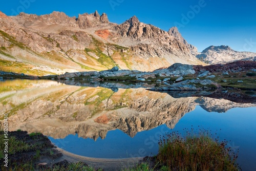 Reflection of mountains in a lake, Ediza Lake, Ansel Adams Wilderness, Inyo National Forest, California, USA photo
