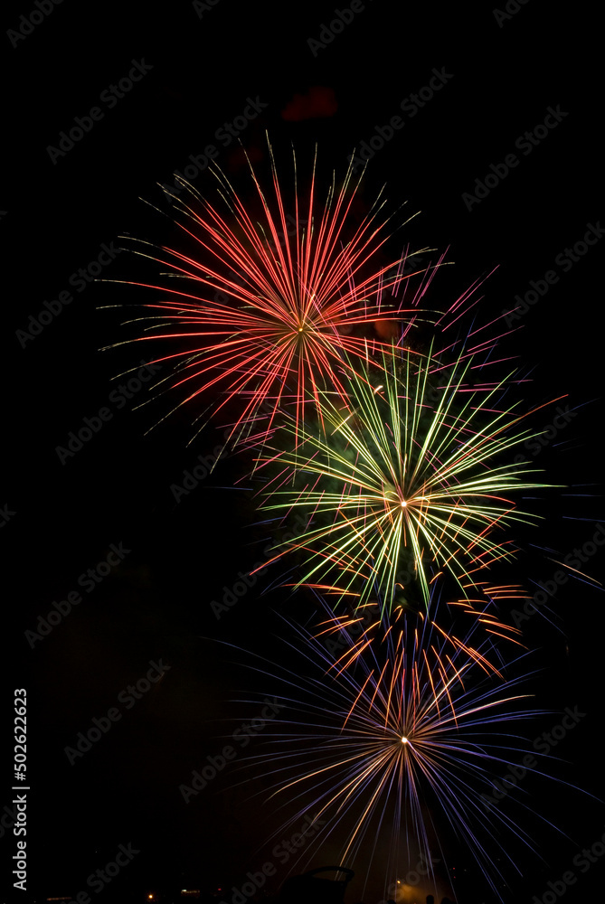 Low angle view of fireworks display at night Low angle view of fireworks display at night