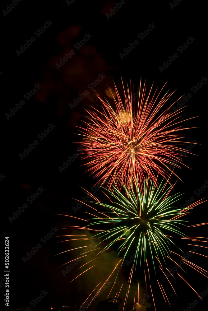 Low angle view of fireworks display at night Low angle view of fireworks display at night
