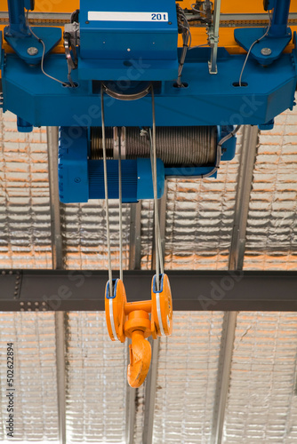 Low angle view of an overhead crane in a factory photo