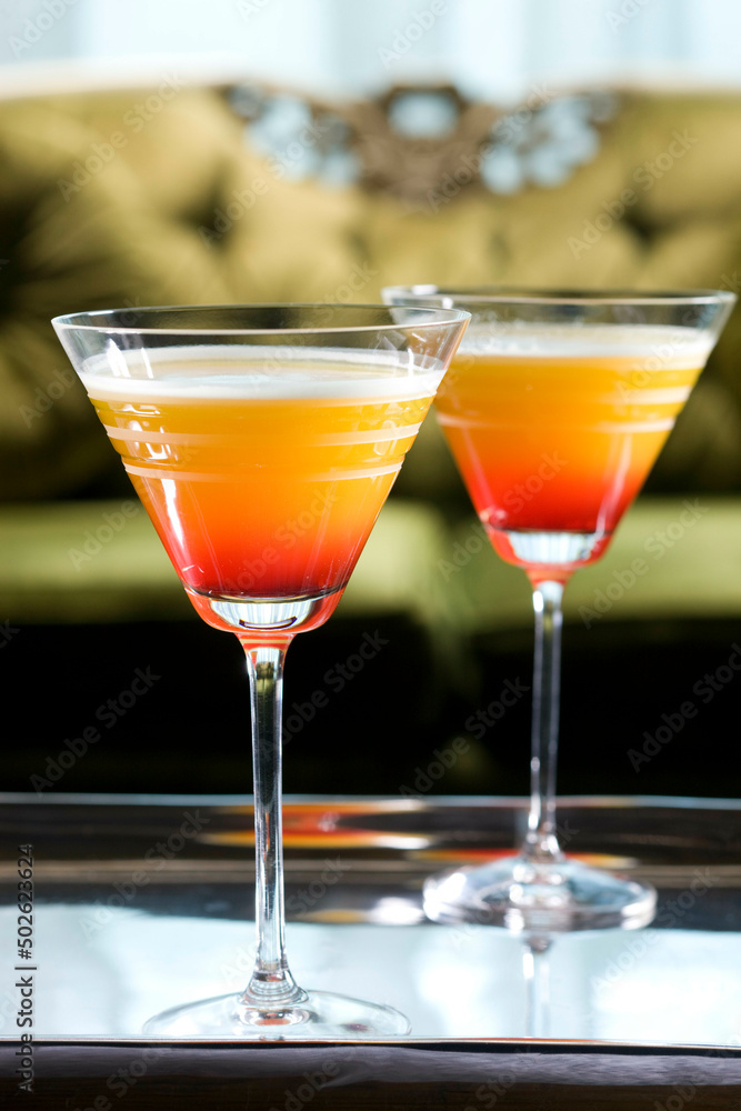 Two glasses of cocktail on a serving tray Two glasses of cocktail on a serving tray