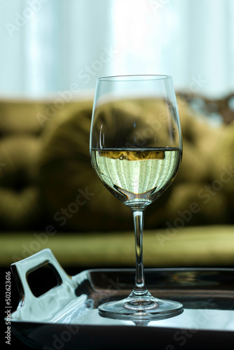 Wine glass on a serving tray © SuperStock