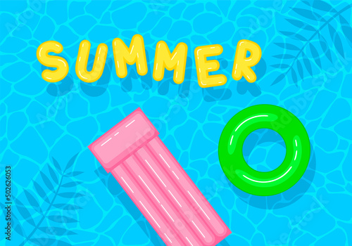 Swimming pool with floating inflatable circle, air mattress and word summer. Top view