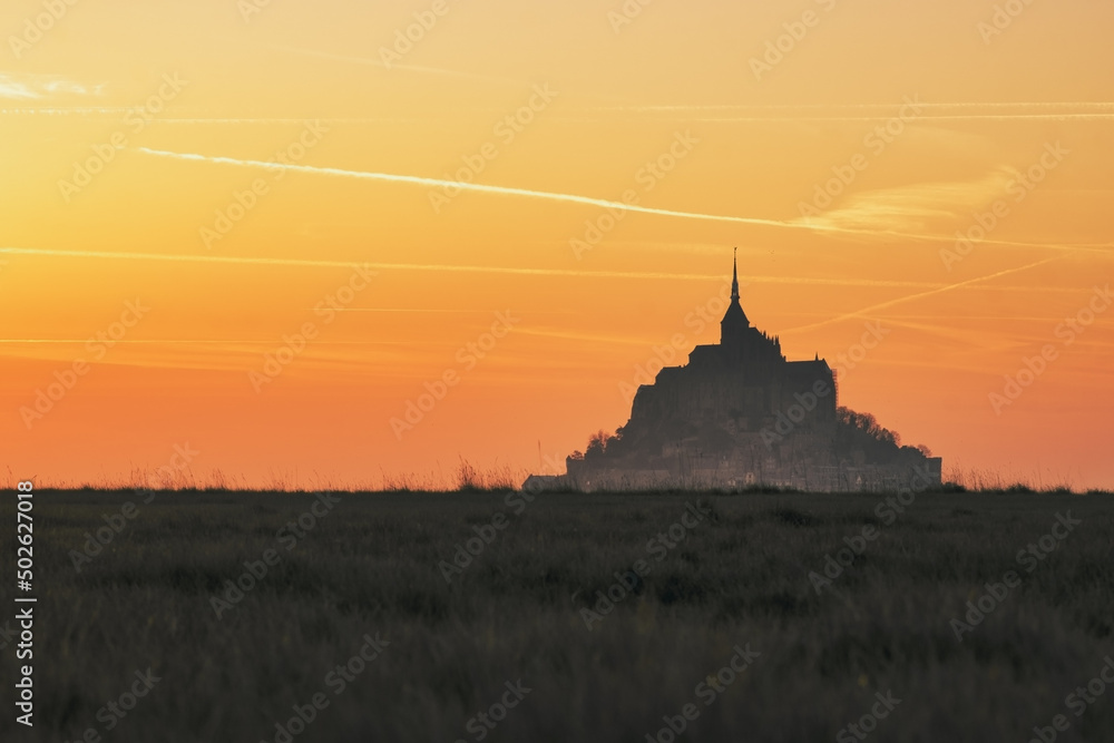 beautiful red sunset at mont saint michel