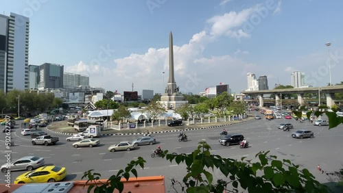 Victory monument, known as Anusawari Chai Samoraphum panoramic view sunny day. Roundabout traffic vehicles on road, blue sky cityscape  photo