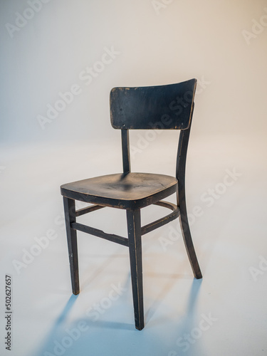 Wooden black antique chair on a white cyclorama