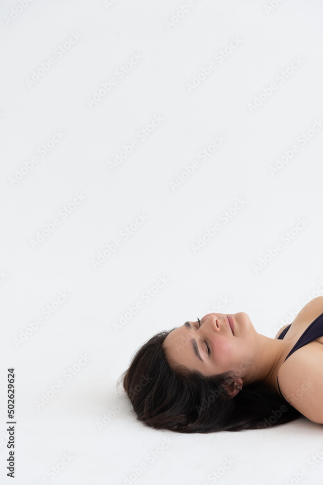Sporty young woman doing relaxing yoga practice isolated on white background. Concept of healthy life and natural balance between body and mental development. Full length Sporty young woman doing relaxing yoga practice isolated on white background. Concept of healthy life and natural balance between body and mental development. Full length
