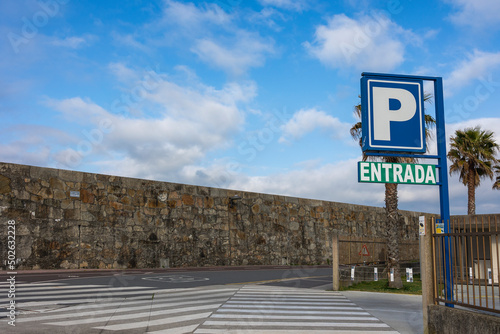 Entrance to the parking lot, at the intersection.