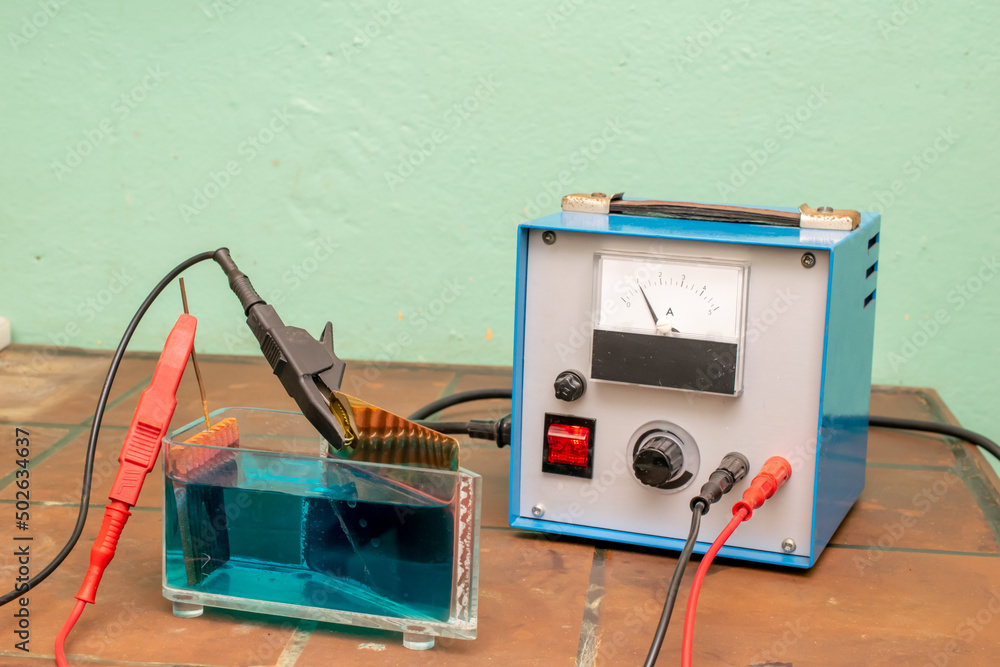 galvanic electrolysis of the solution with power supply Stock Photo