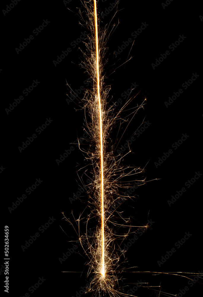 Sparkler trail of light with sparks in a straight line Sparkler trail of light with sparks in a straight line